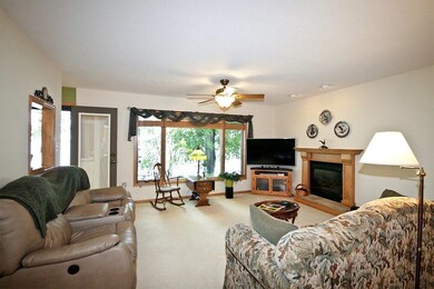 Living room with gas burning fireplace.