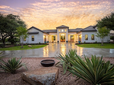 Mediterranean / spanish house with a lawn, stucco