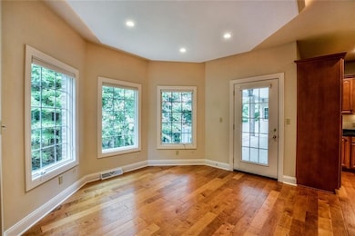 Bright and cheery eat-in area overlooks the wooded