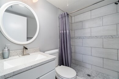 Bathroom featuring vanity, a shower with curtain,