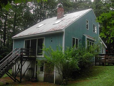 Exterior Back. Riverside view;...