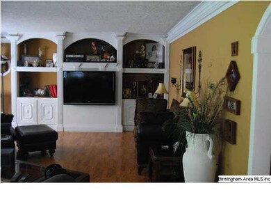 Plenty of built ins, and crown molding with back l