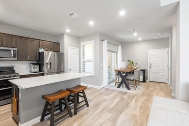 Kitchen with stainless steel appliances, light co