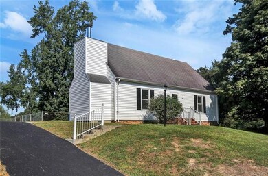 Freshly paved driveway with room for numerous vehi