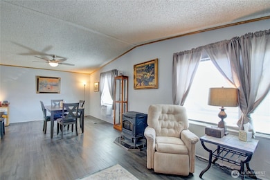 Open concept living/dining area with vinyl plank flooring.