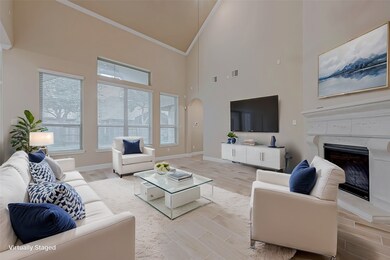 This spacious living room features high ceilings,