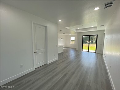 Unfurnished living room featuring wood-type floori