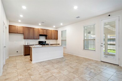 View of the kitchen to the built in sunroom behind the house