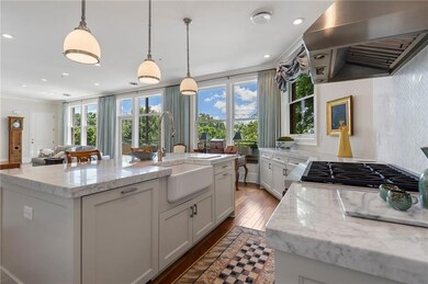 Chef's kitchen with top of the line appliances and upgraded marble countertops