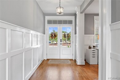 Front entry with chandelier, chair rail, and entra