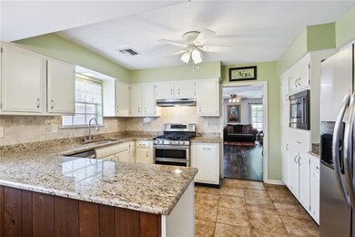 Kitchen with granite counter tops and stainless st