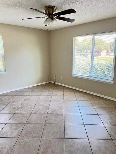 Spare room with plenty of natural light, light ti