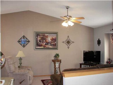 Another view of the living room shows the vaulted 