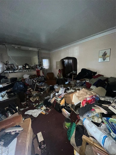 Miscellaneous room with ornamental molding and a textured ceiling