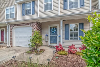 View of exterior entry with a garage