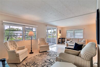 View living room and sitting area. Door sliders le