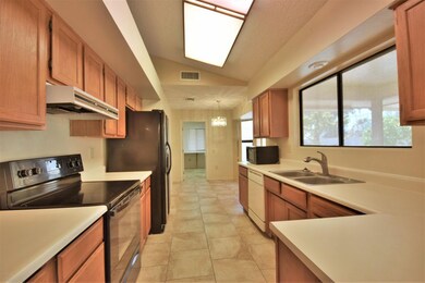 Oak cabinets and view to the backyard