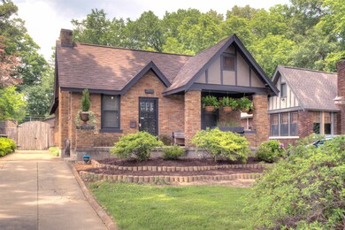 Tudor house featuring a front lawn