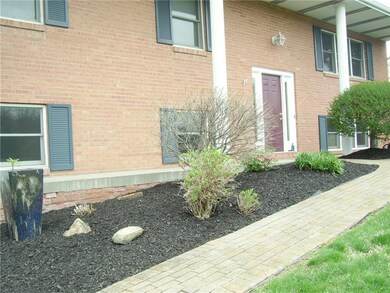 Walkway to front of home with brick walkway and be
