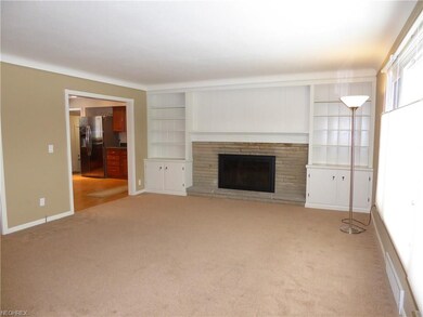 Living Room leads to Kitchen through the door on t