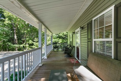Front porch in quiet cove with parking for 8