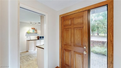 View of front door entryway/access to unit w/private garage (attached) to the right of this door ...