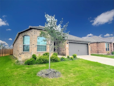 Ranch-style home with an attached garage, driveway