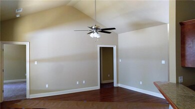 Large den with vaulted ceiling, lots of natural li