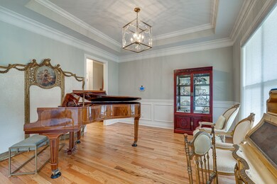 TREY CEILING IN FORMAL DINING ROOM. THIS IS BEING USED AS A MUSIC ROOM.