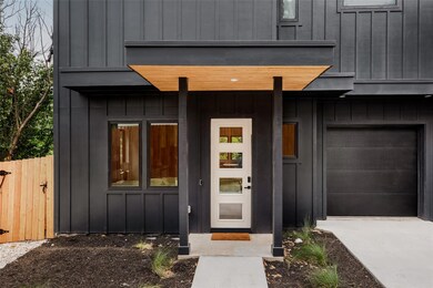 Doorway to property with board and batten siding,