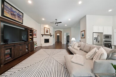 This impressive home offers a wonderful open floor plan.  The shared wood floors, neutral paint, and raised ceilings throughout allow these spaces to flow easily from one to the next.