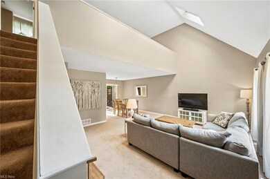 Great room features cathedral ceilings and skyligh