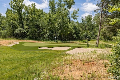 View of property's community with golf course view and a putting green