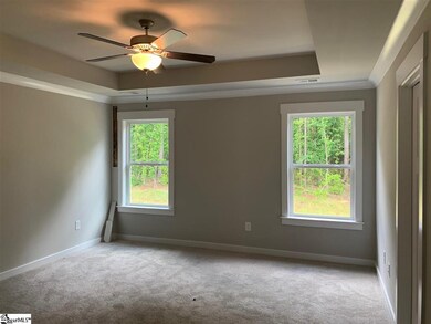 Rear-facing owner's suite with wooded views, walk 