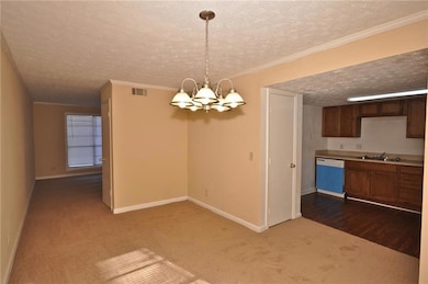 Unfurnished dining area with a notable chandelier,