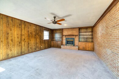 Large den/ game room with fireplace