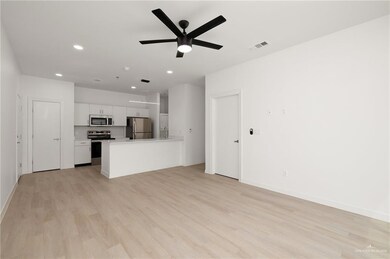 Unfurnished living room with light hardwood / wood-style flooring and ceiling fan