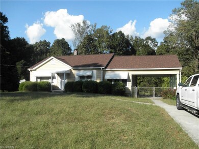 Carport for parking car or can be used like a patio like the owners did