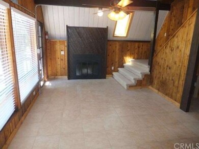 LIVING ROOM WITH COZY FIREPLACE AND NEW TILE FLOOR