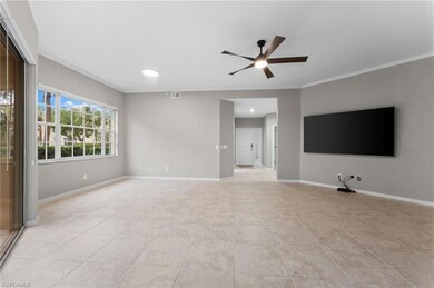 Living room featuring crown molding