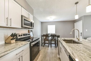 Upgrades include flooring, backsplash, fixtures, c