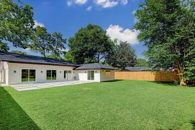 The 10,381 SF lot offers a large yard with new fen
