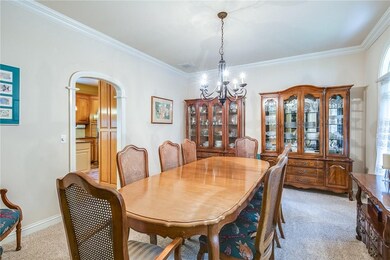 The formal dining room provides ample space for a