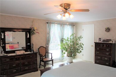 Large master bedroom with balcony through siding d