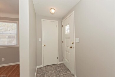 Welcome foyer at front door and coat closet.