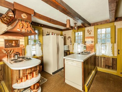 Kitchen with copper range hood....
