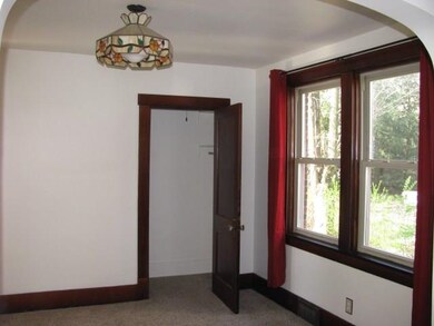 Bright natural light floods the dining room throug