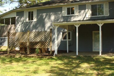 Walk out basement with covered porch and large bac
