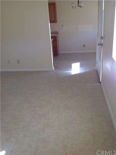 living room with recently added tile looks adjoins