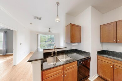 Kitchen featuring dark stone countertops, visible 